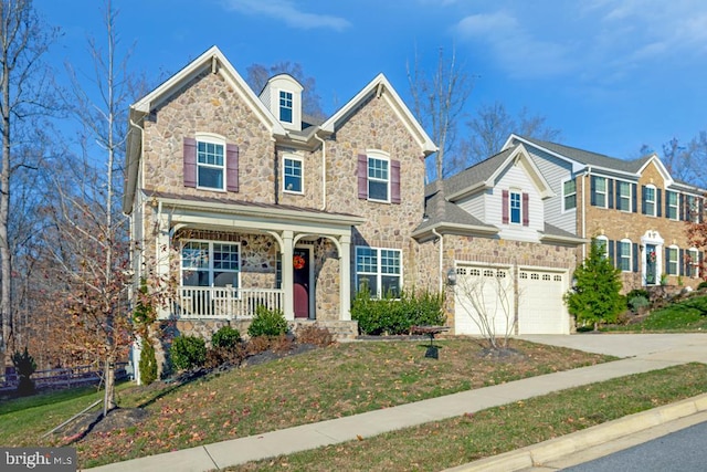 view of front facade featuring a garage and covered porch