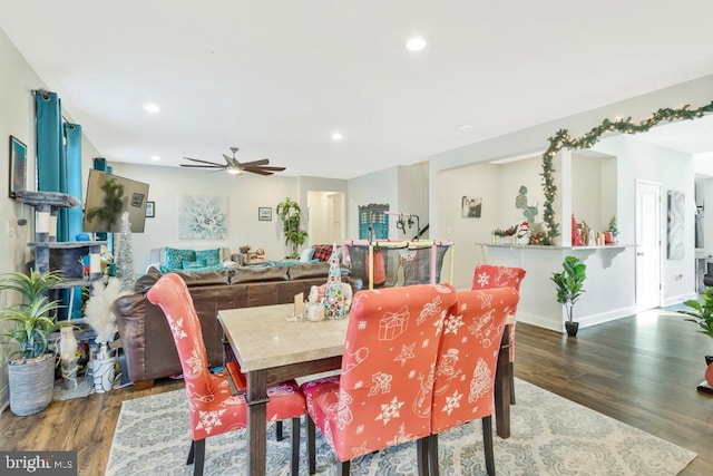 dining room featuring ceiling fan and dark hardwood / wood-style flooring