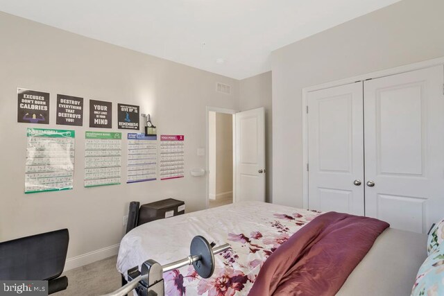 bedroom with carpet floors and a closet