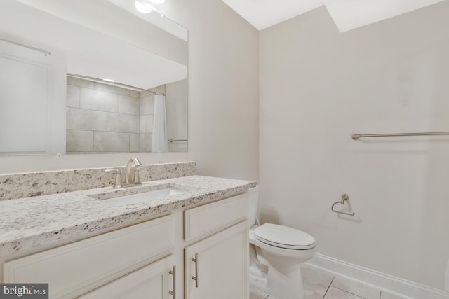 bathroom featuring vanity, tile patterned floors, toilet, and walk in shower