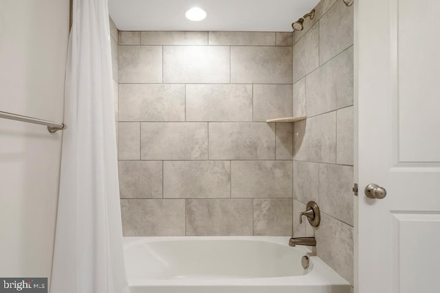 bathroom with shower / bathtub combination with curtain