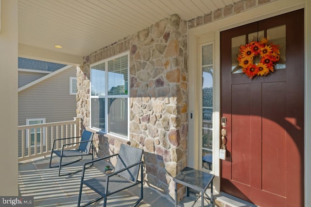 property entrance with covered porch