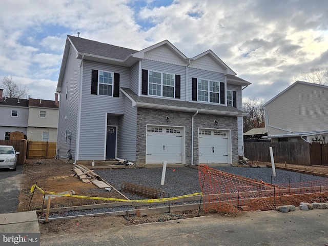 view of front of property featuring a garage