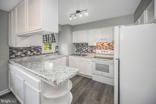 kitchen featuring sink, dark wood-type flooring, white appliances, decorative backsplash, and white cabinets