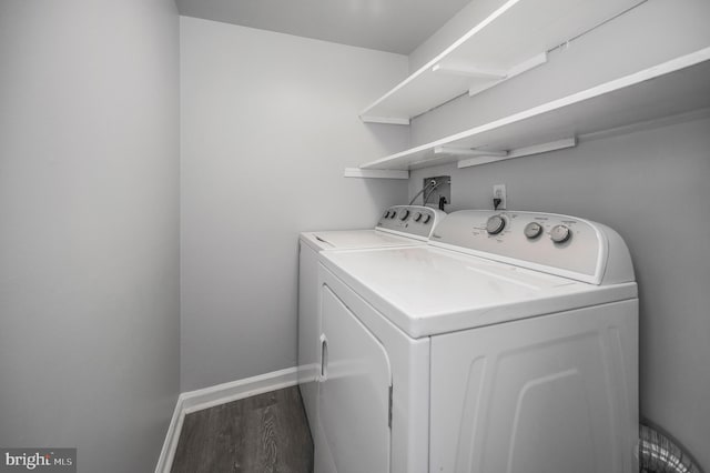 washroom featuring washer and clothes dryer and hardwood / wood-style flooring