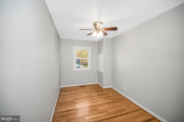 unfurnished room featuring light hardwood / wood-style floors and ceiling fan