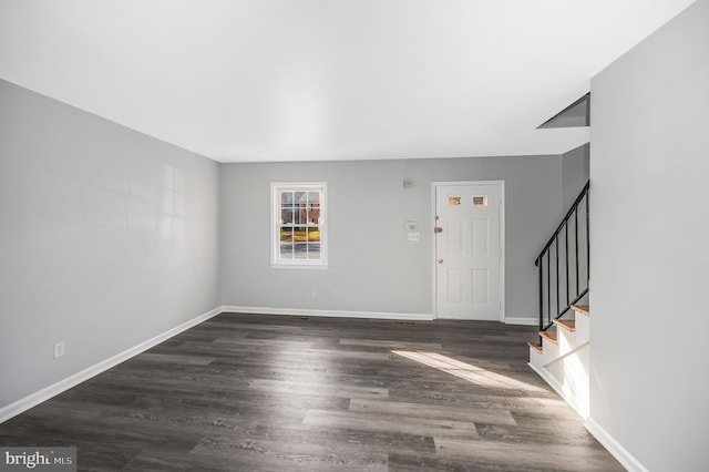 entrance foyer featuring dark hardwood / wood-style floors