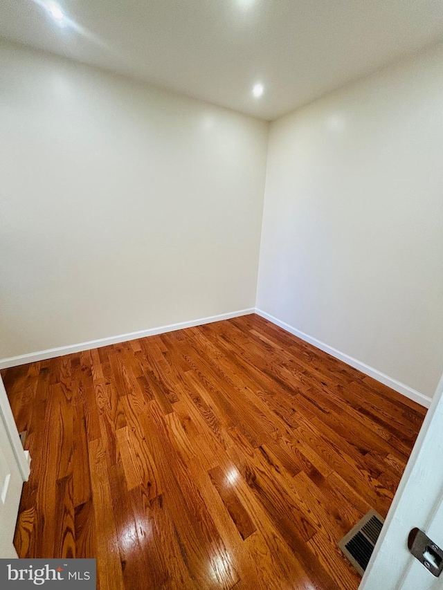 empty room featuring hardwood / wood-style floors