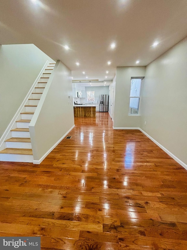 unfurnished living room featuring hardwood / wood-style floors