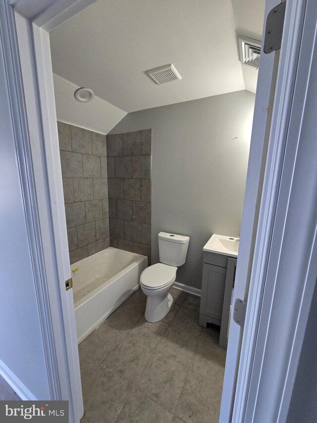bathroom with lofted ceiling, visible vents, toilet, tub / shower combination, and vanity
