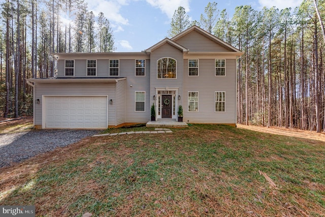 view of front facade featuring a front yard and a garage