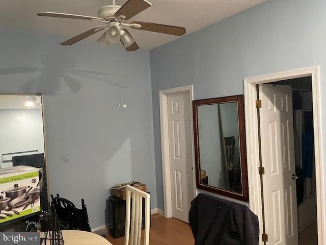 interior space with hardwood / wood-style flooring and ceiling fan