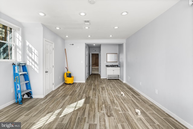 unfurnished living room featuring light hardwood / wood-style floors