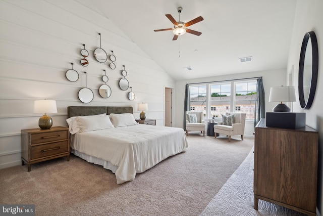 carpeted bedroom with high vaulted ceiling and ceiling fan