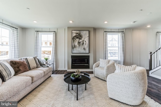 living room with a wealth of natural light and light wood-type flooring