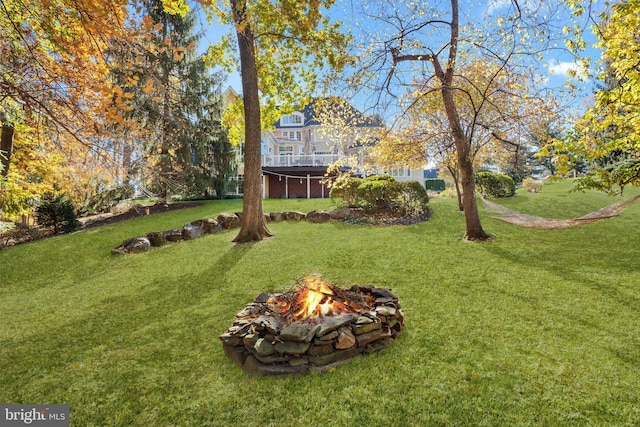 view of yard with a fire pit