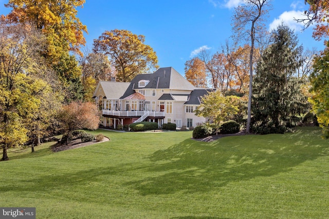 exterior space with a lawn and a deck