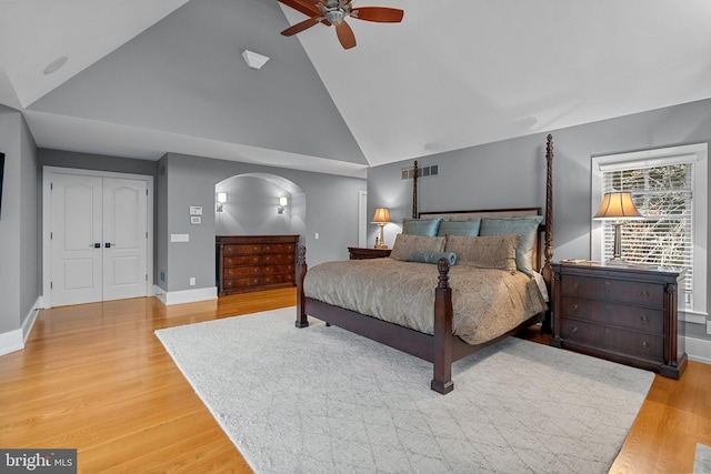 bedroom featuring ceiling fan, high vaulted ceiling, and light hardwood / wood-style floors