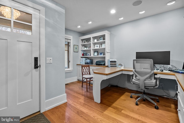 office area featuring plenty of natural light and light hardwood / wood-style flooring