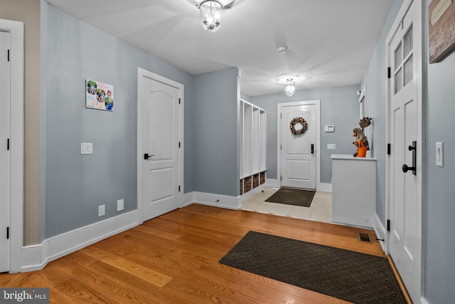 entryway with light hardwood / wood-style flooring