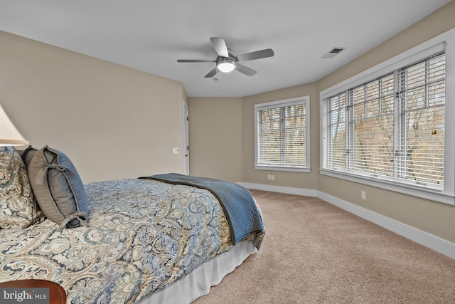 carpeted bedroom with ceiling fan