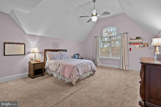 bedroom with vaulted ceiling, light colored carpet, and ceiling fan