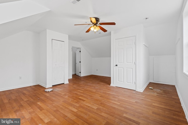 additional living space featuring ceiling fan, light hardwood / wood-style floors, and lofted ceiling