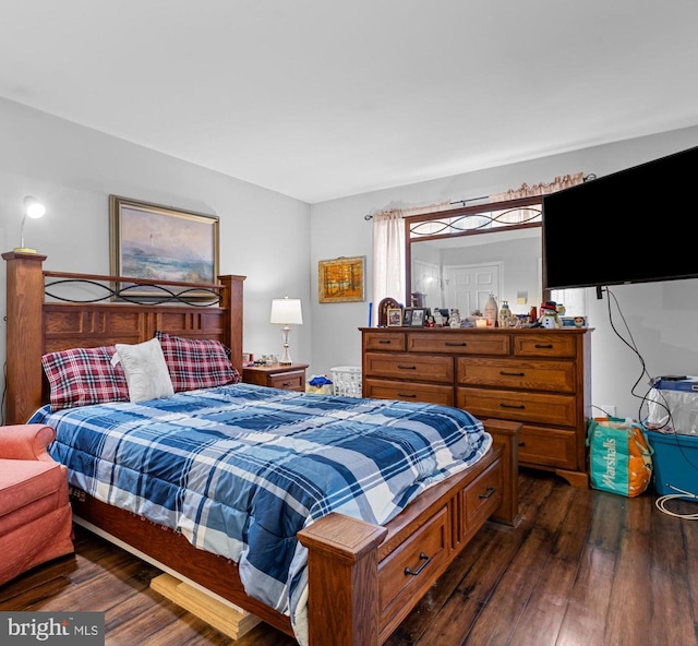 bedroom featuring dark wood-type flooring