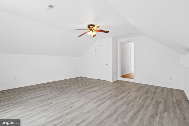 additional living space featuring ceiling fan, light hardwood / wood-style floors, and lofted ceiling