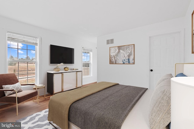 bedroom with hardwood / wood-style flooring