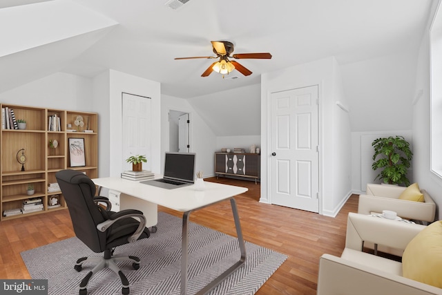 office area featuring ceiling fan, light hardwood / wood-style floors, and vaulted ceiling