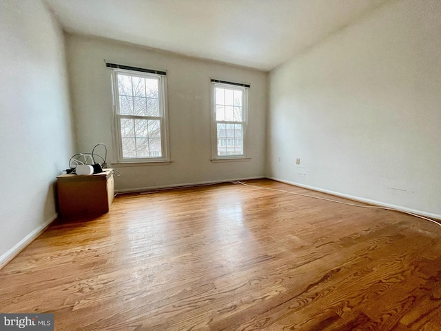 unfurnished room with light hardwood / wood-style flooring