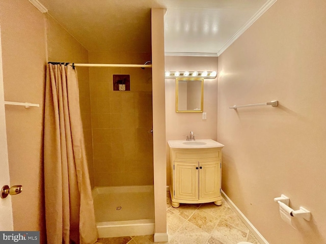 bathroom with curtained shower, crown molding, and vanity