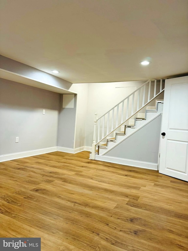 basement with wood-type flooring