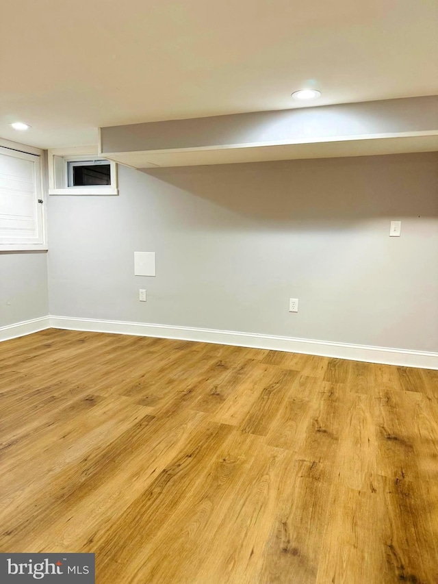 basement featuring light hardwood / wood-style floors