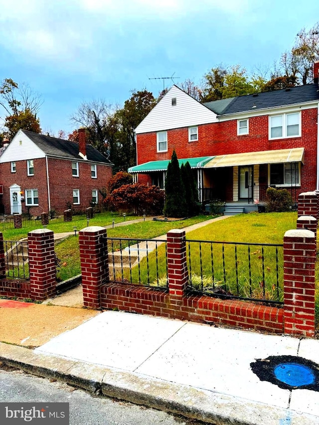 view of front of house featuring covered porch and a front lawn