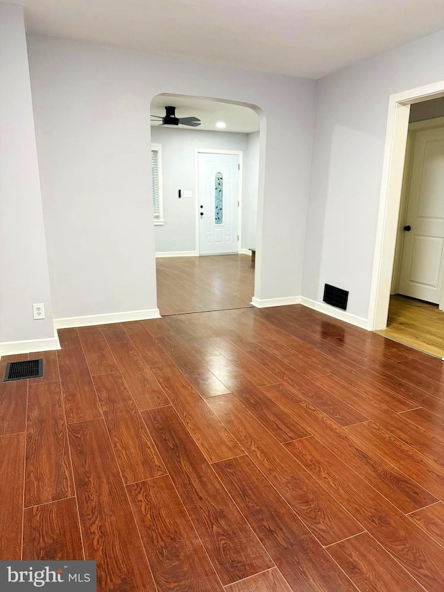 unfurnished room with ceiling fan and hardwood / wood-style floors