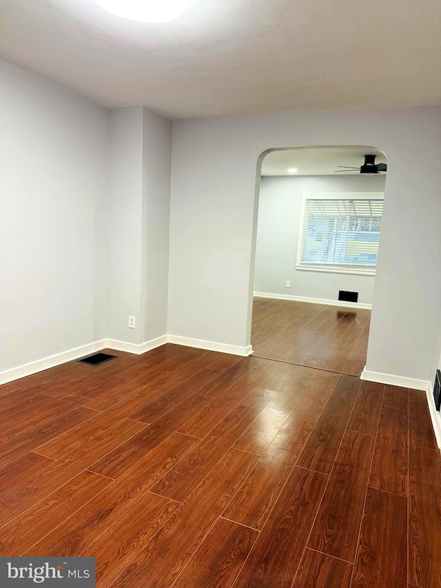 unfurnished room with hardwood / wood-style floors