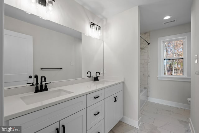 full bathroom featuring marble finish floor, visible vents, a sink, and baseboards