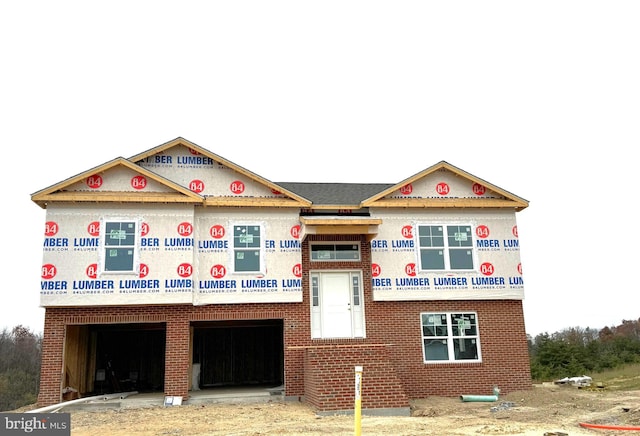 property in mid-construction with a garage