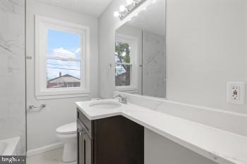 full bathroom featuring vanity, toilet, and separate shower and tub