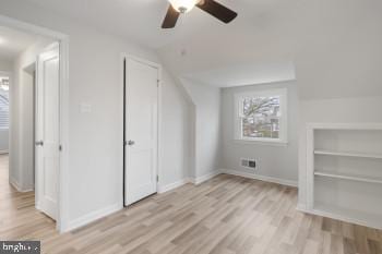 bonus room with ceiling fan, light hardwood / wood-style floors, and lofted ceiling