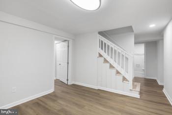 spare room featuring dark wood-type flooring