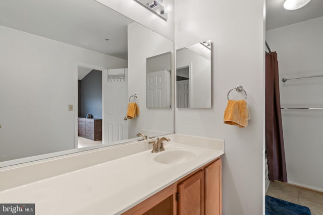 bathroom with tile patterned flooring and vanity