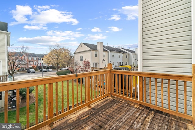 wooden terrace with a yard