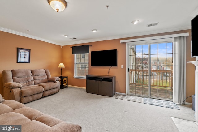 carpeted living room with plenty of natural light and crown molding