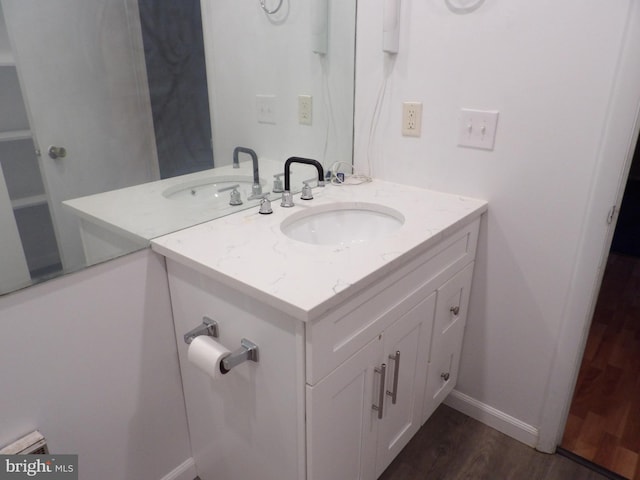 bathroom featuring hardwood / wood-style floors and vanity