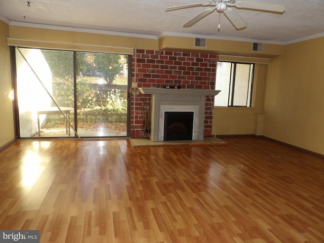 unfurnished living room with hardwood / wood-style floors, ceiling fan, and ornamental molding