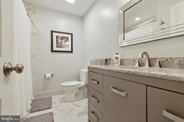 bathroom with vanity and toilet