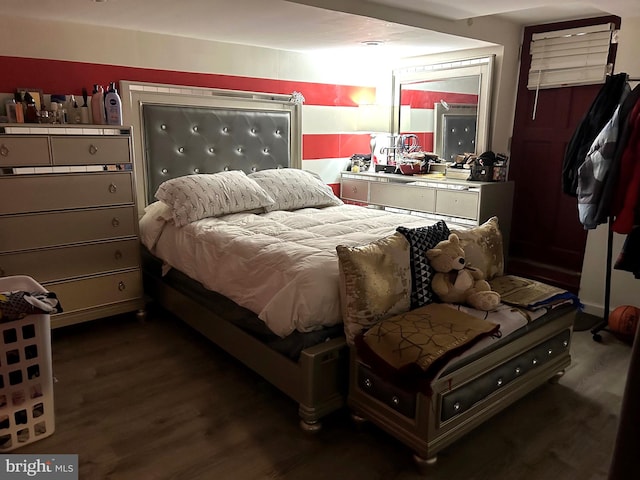 bedroom with dark wood-type flooring